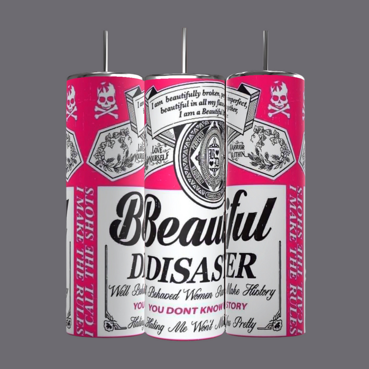 Three Kreative Kreationz "Beautiful Disaster" 20oz Tumblers with pink and white designs stand against a black background. The design features various text and graphic elements like skulls and logos. Each spill-proof tumbler keeps beverages hot or cold and comes with a reusable metal straw and lid.