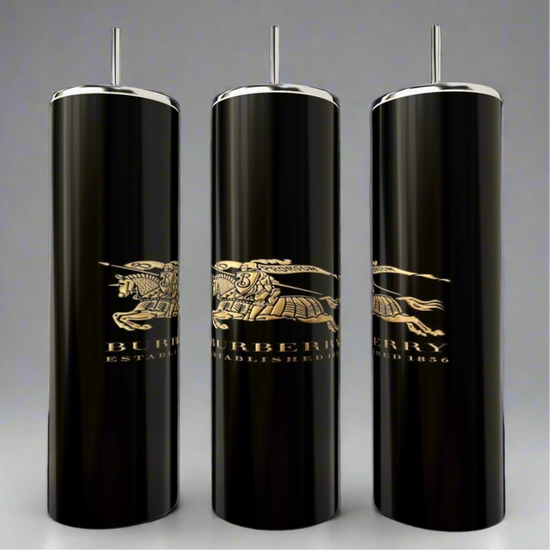 Three sleek black Burberry 20oz Skinny Tumblers from Kreative Kreationz feature silver tops and reusable straws, boasting a golden knight on horseback logo with 