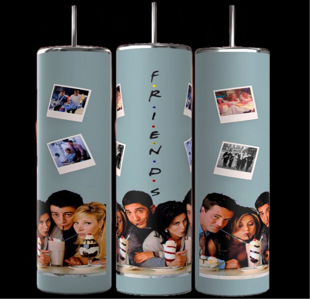 Three cylindrical Teal Friends TV Show 20oz Tumblers by Kreative Kreationz feature images from the TV show "Friends." Each tumbler showcases a cast photo and Polaroids of memorable moments. The central tumbler displays the word "FRIENDS" vertically. With double-wall insulation and a muted green background, they come in a stylish gift box.