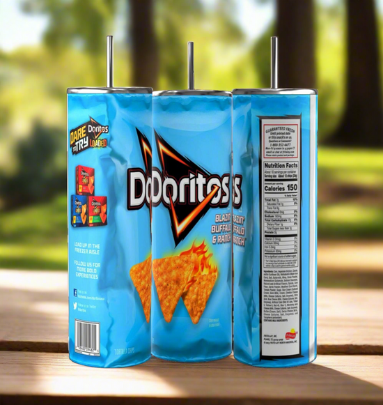 Three Kreative Kreationz Doritos Collection 20oz Stainless Steel Skinny Tumblers, designed to mimic Doritos bags with a blue background and orange logo, feature the Blazin' Buffalo & Ranch flavor. They sit on a wooden surface outdoors against a blurred green and brown backdrop.