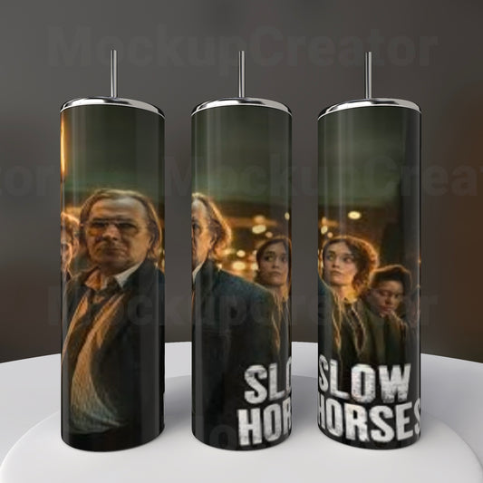 Kreative Kreationz's Slow Horses 20oz stainless steel tumblers showcase a sublimated design resembling a movie poster, featuring formal-clad figures against a dark, moody backdrop.