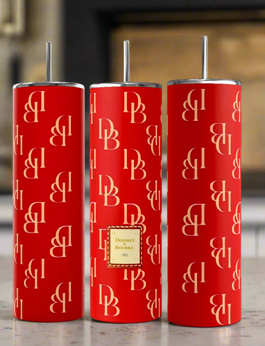 Three tall, red insulated Dooney and Bourke RED 20oz Tumblers by Kreative Kreationz with double-wall insulation are shown side by side against a black background. Each tumbler features a repeating pattern of "DB" in gold color. The center tumbler also has a rectangular gold patch with "Dooney & Bourke 1975" written on it.