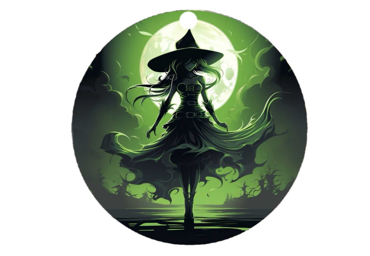 Wicked Witch Christmas Tree Ornament by Kreative Kreationz features a witch in a flowing dress and pointed hat standing before a glowing full moon, perfect for sublimated design. The ornament is bathed in green light, creating a mystical atmosphere with swirling shadows and faint outlines of trees—an ideal inspiration for holiday decor.