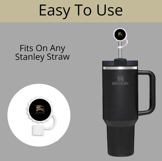 The Burberry Straw Cover by Kreative Kreationz is designed for Stanley cups in 40oz, 30oz, and 20oz sizes with 10mm straws. Featured in black with a handle and a cap that fits any Stanley straw, it's showcased on a light gray background labeled "Easy To Use"—a great practical gift idea.