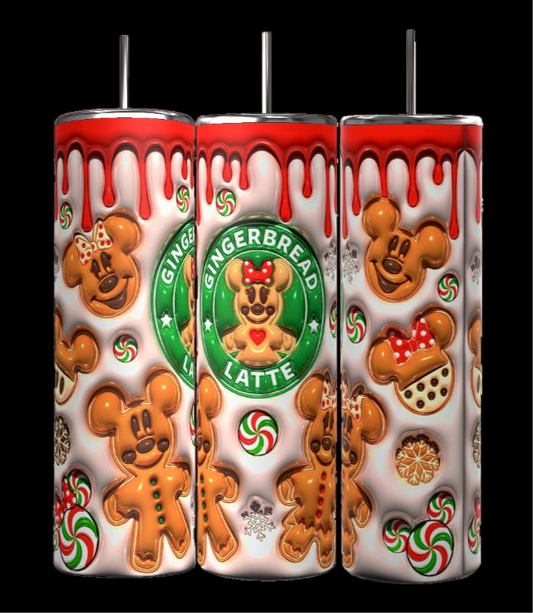 A set of three cylindrical 20 oz tumblers from Kreative Kreationz showcases festive gingerbread designs, including bear-shaped cookies, red dripping icing, and candy patterns. The centerpiece is the Gingerbread Latte Puffy 20oz Tumbler, featuring a green circle labeled "Gingerbread Latte" around a gingerbread figure—ideal for fans of durable drinkware.