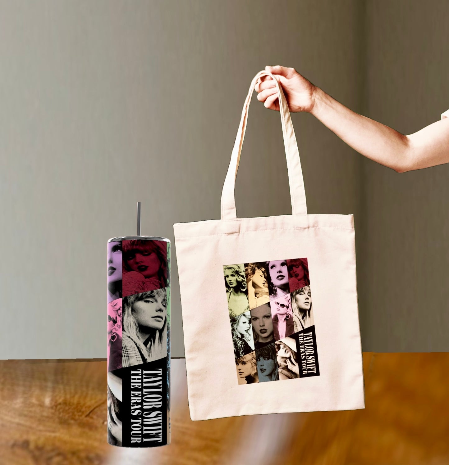 A tall 20oz tumbler and a white canvas bag from the "Eras Tumbler/Bag Gift Set" by Kreative Kreationz are displayed on a wooden surface. Both items feature colorful, artistic portraits of a woman alongside the text "The Eras Tour," showcasing different styles and expressions.