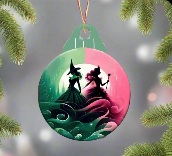 The Kreative Kreationz Wicked Christmas Tree Ornament showcases silhouetted figures of two witches, one with a pointed hat and the other holding a wand, set against swirling colors. Framed by pine branches, this sublimated design is an ideal addition to your holiday decor.