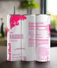 Three cans of Red Bull, Barbie Edition, sit on a countertop, each featuring pink text and a logo on a white background. Beside them stands the Barbie Edition 20oz Tumbler by Kreative Kreationz, exuding the same playful flair with its reusable straw. The scene unfolds against a softly blurred kitchen backdrop.