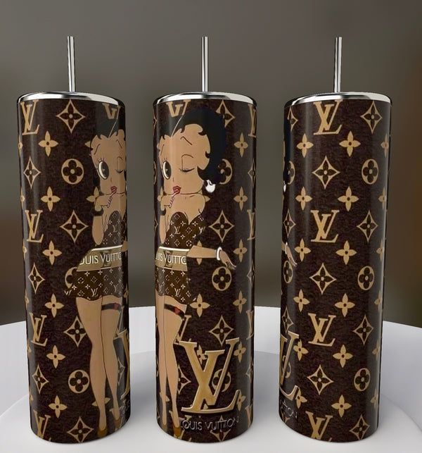 Three Betty B LV 20oz Skinny Tumblers by Kreative Kreationz feature a brown and gold pattern with cartoon designs, including Betty Boop and Louis Vuitton motifs. Each stylish tumbler includes a sleek silver straw.