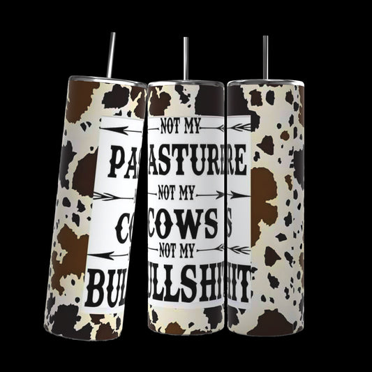 Three Kreative Kreationz "Not my Cows Not My Pasture" 20oz Stainless Steel Tumblers with durable construction, arranged side-by-side against a black background. These cow-print cylindrical objects feature the text, "Not my pasture, not my cows, not my bullshit," on one side for everyday use.