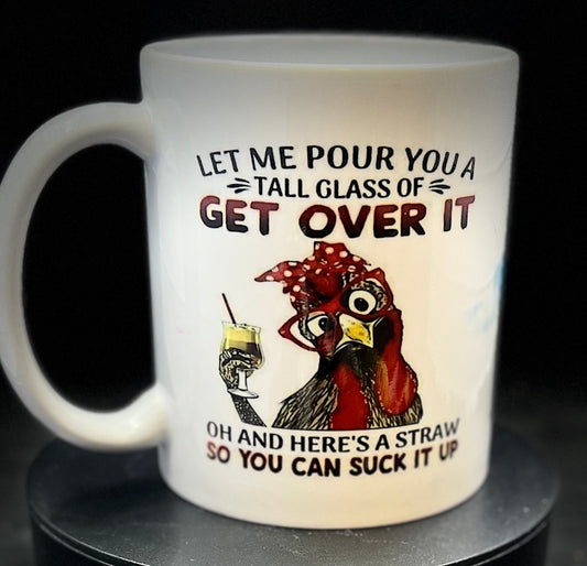 The Chicken Ceramic Mug by Kreative Kreationz features an adorable illustration of a chicken wearing a red bandana and glasses, holding a yellow drink and straw. The text humorously reads, "Let me pour you a tall glass of get over it. Oh and here's a straw so you can suck it up." It's the perfect gift for Swiftie fans!