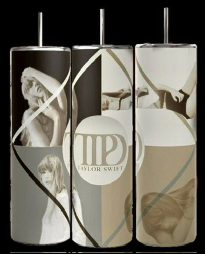 Three cylindrical Taylor Swift tumblers from Kreative Kreationz's "The Tortured Poets Department" collection are displayed against a black background. Each 20oz Skinny Tumbler features artistic black, white, and sepia-toned photographs and illustrations of Taylor Swift, along with her name and logo prominently shown. They come with a reusable straw and spill-proof lid for convenience.