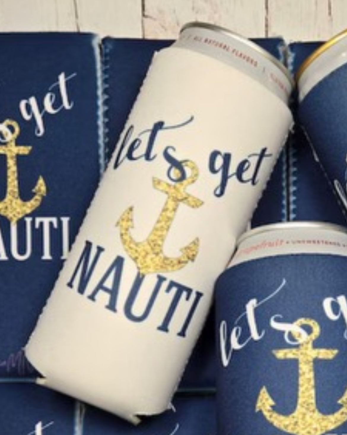 A white can with a gold anchor and blue cursive text that reads "let's get NAUTI" is displayed among similar blue cans and custom koozies from the Nautical Beach Theme 6-Pack Customizable Koozies collection by Kreative Kreationz. The design perfectly captures a nautical beach theme, cleverly playing on the words "nautical" and "naughty.