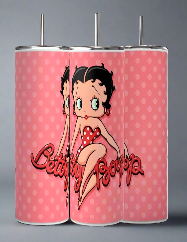 The Kreative Kreationz Betty B 20oz Skinny Tumblers come in sets of three pink designs with red polka dots, showcasing Betty Boop in a matching outfit. Their durable build ensures long-lasting enjoyment, making them an ideal sublimated tumbler for every fan.