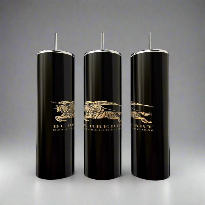 Three tall, sleek 20oz Burberry Skinny Tumblers with double-wall insulation stand on a gray background. Each black cylindrical container is topped with silver and features the iconic knight on horseback alongside the Burberry name in gold, branded by Kreative Kreationz.