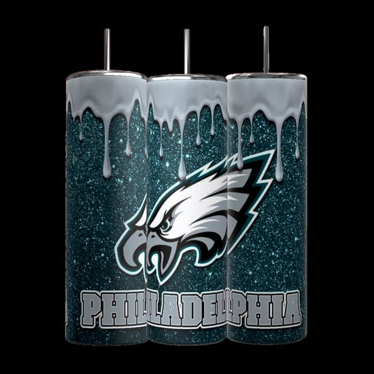 Kreative Kreationz's Philadelphia Eagles 20oz Skinny Tumblers feature a sparkling green backdrop with the team logo and "Philadelphia" beneath, plus a silver paint drip design. Each includes a spill-proof lid and reusable straw for convenience.