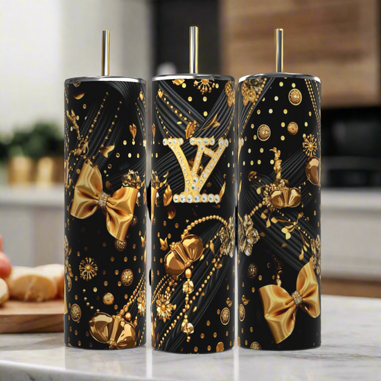 Three stylish, cylindrical Kreative Kreationz tumblers in a black finish feature golden bows and pearls, each displaying the iconic 