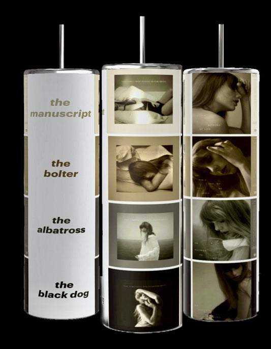 Three cylindrical stands display various monochromatic photographs of women in thoughtful and pensive poses. The left stand showcases titles "the manuscript," "the bolter," "the albatross," and "the black dog." Right next to them, a display features the Taylor Swift TTPD Collage 20oz Skinny Tumbler by Kreative Kreationz, equipped with a spill-proof lid.