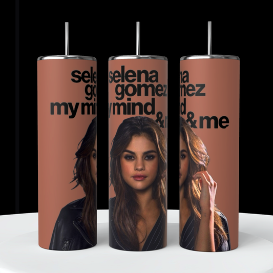 Three Kreative Kreationz Selena Gomez My Mind and Me 20oz Stainless Steel Tumblers are displayed on a white surface against a black background. Each tumbler features a photograph of Selena Gomez with brown hair, wearing a leather jacket, along with the text "Selena Gomez My Mind & Me" in bold black font.