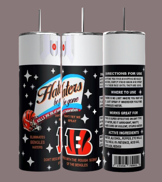 The "Bengals Haters 20oz Skinny Tumbler" by Kreative Kreationz sits beside three humorous spray cans labeled "Haters Be Gone." The cans, adorned with colorful graphics, directions for use, and ingredients, feature a basketball design and the phrase "Eliminates Bengals Haters.