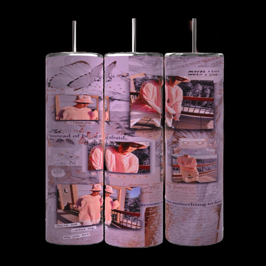 Three cylindrical pillars exhibit a collage of pink and white-themed photos and handwritten text, featuring images of a person in a pink hoodie and hat, posing in various outdoor settings. Butterflies and abstract designs create the backdrop, evoking the style of the Justin Bieber 20oz Tumbler from Kreative Kreationz.