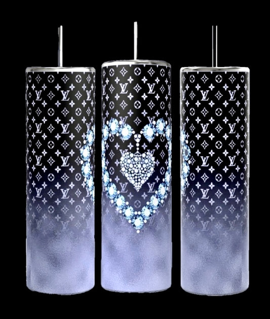 Three LV Designer 20oz Tumblers by Kreative Kreationz feature a tall, cylindrical design with spill-proof metallic lids and straws. They showcase a black and white designer pattern, with the middle tumbler adorned with a heart design crafted from blue flowers. Each tumbler transitions to a gradient foggy gray towards the bottom.