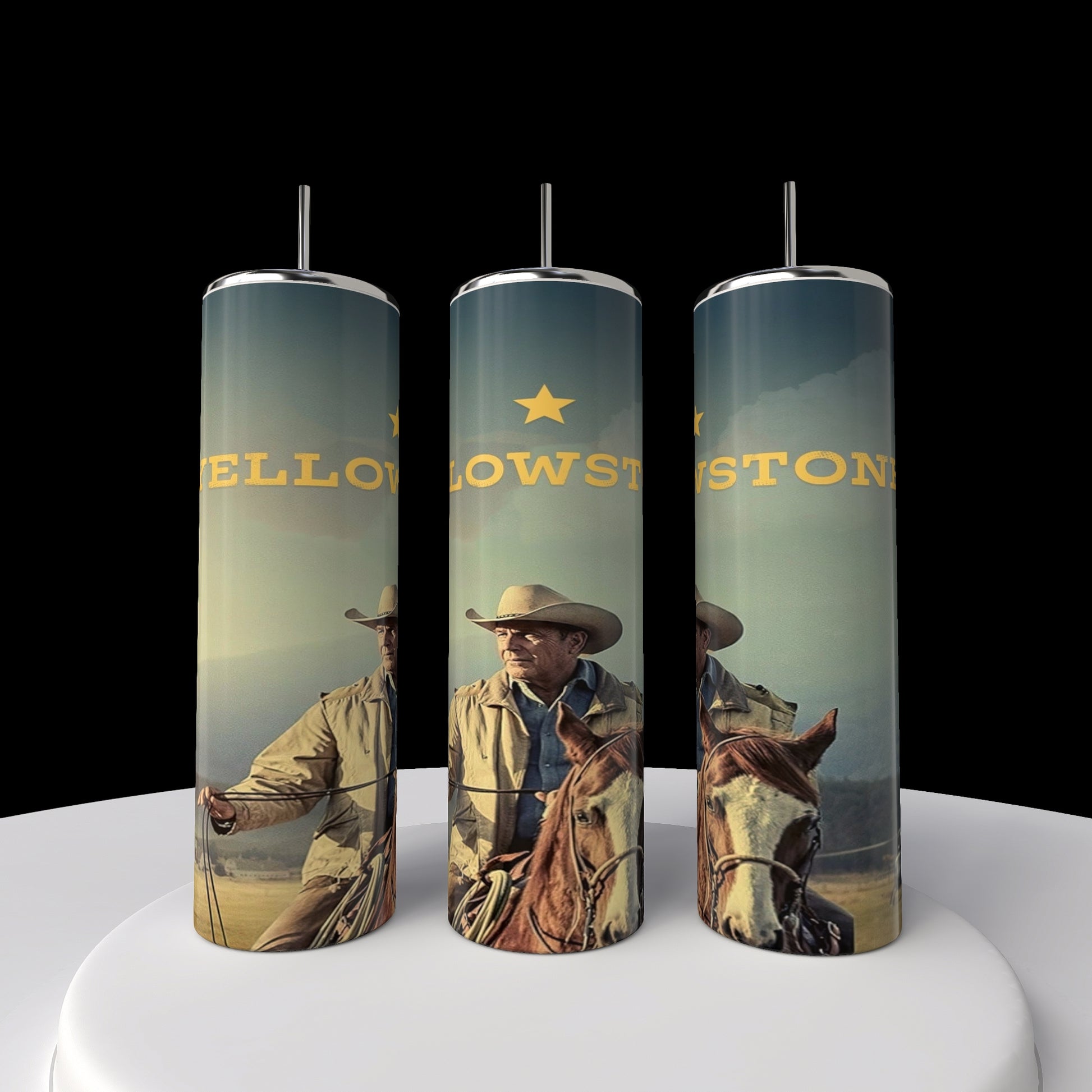 The Kreative Kreationz Yellowstone 20oz Tumbler showcases a cowboy on horseback against mountains, with "Yellowstone" and a star subtly in the backdrop, creating an engaging sublimated design. Comes with a straw; available as a set of three tall, cylindrical stainless steel tumblers.