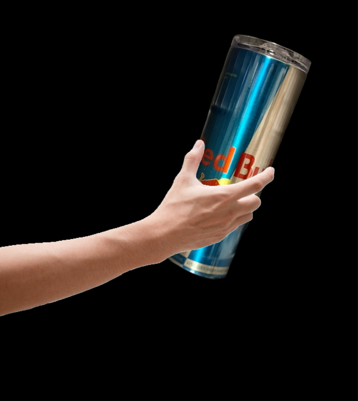 A hand holding a large Red Bull can against a plain black background evokes the sleek design of the Kreative Kreationz Red Bull Sugar Free Silver Stainless Steel 20oz Tumbler. The smooth lines suggest durability, featuring a spill-proof lid, promising an uninterrupted energy boost for any adventure.