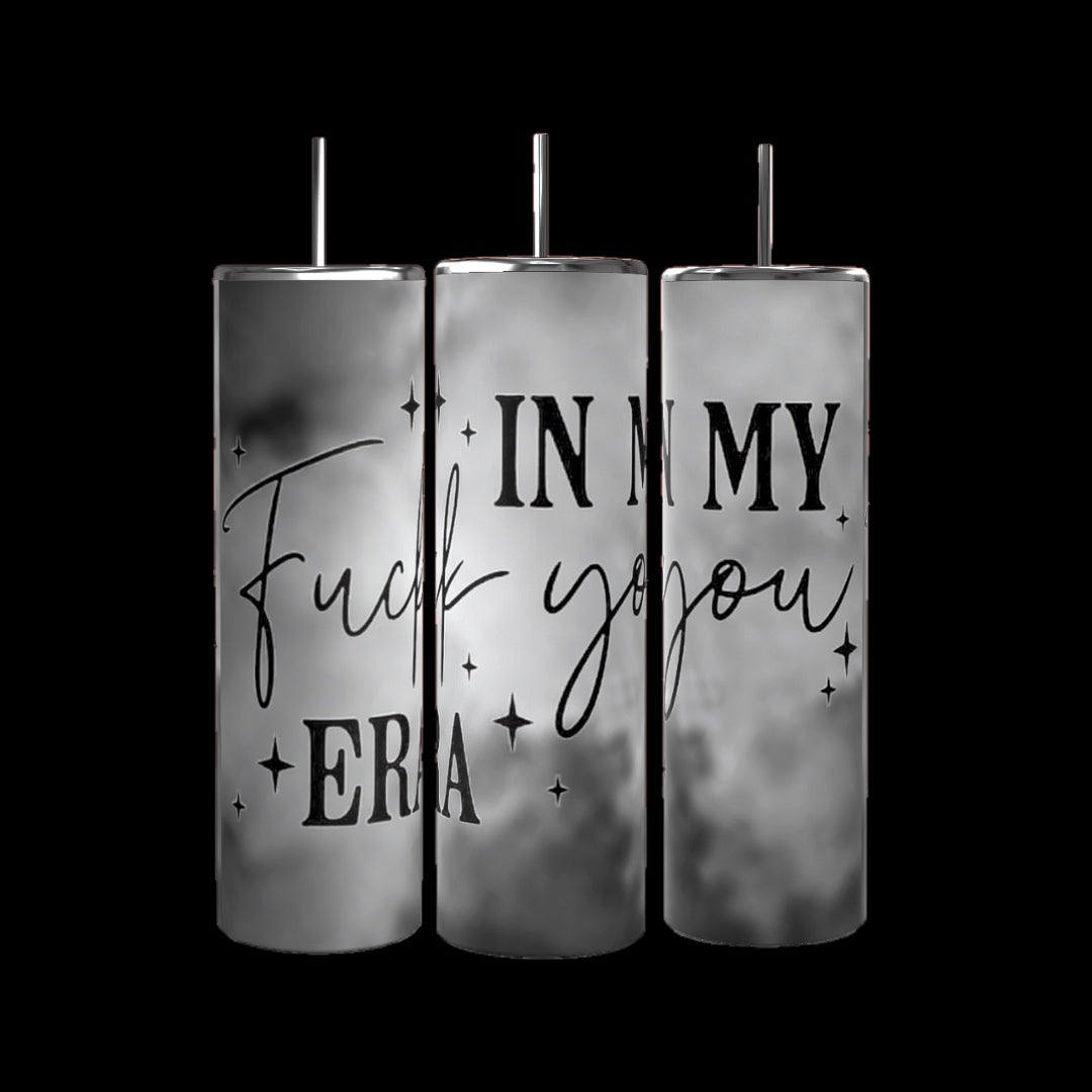 Three "In My Fu*k You Era" 20oz tumblers by Kreative Kreationz, each featuring silver lids and straws. The tumblers are adorned with parts of the phrase "In my f*ck you era" in black cursive and bold letters, set against a marbled gray background with small sparkles.