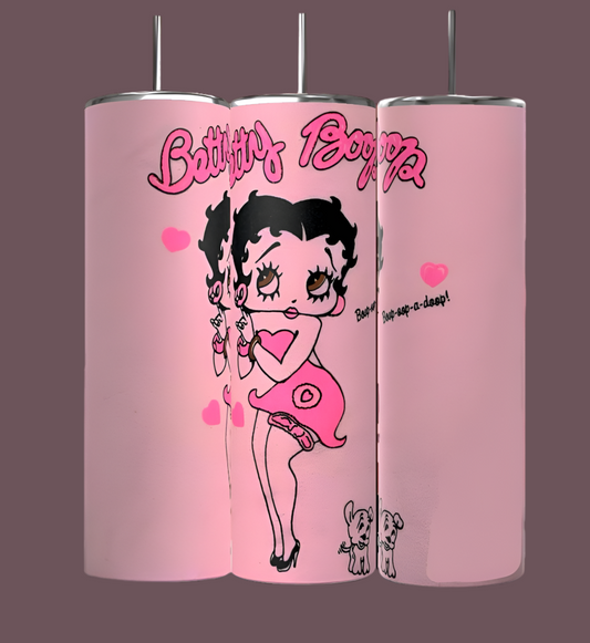 The BB 20oz Skinny Tumblers by Kreative Kreationz feature three designs of Betty Boop in a heart-themed outfit with two small dogs and heart graphics on a dark pink backdrop. These durable, sublimated tumblers are both stylish and long-lasting.