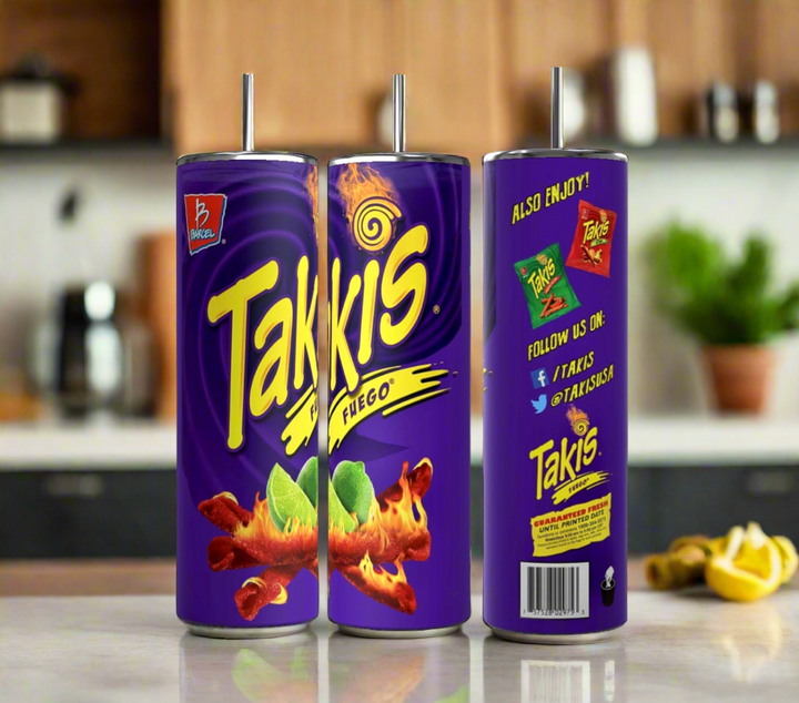 Image of three cylindrical cups with metal straws, designed to resemble Takis Fuego snack packaging. The Takis 20oz Stainless Steel Skinny Tumblers from Kreative Kreationz display the Takis logo, fiery snack sticks, and lime slices on a purple background. With a 20 oz capacity, they keep beverages hot or cold. Blurred kitchen background.