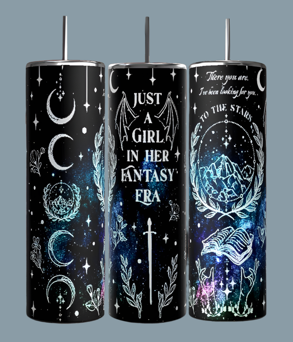 Three 20oz tall tumblers from Kreative Kreationz feature celestial designs set against a dark background. One tumbler displays "Just a Girl in my Fantasy Era" adorned with moons, stars, and mystical creatures. Another tumbler showcases the phrase "To the Stars" accompanied by illustrations of a wolf and trees. Each tumbler is equipped with a spill-proof lid for added convenience.