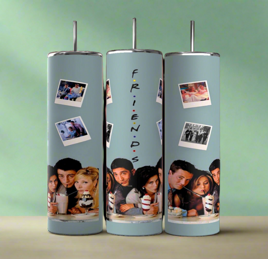 Three cylindrical Teal Friends TV Show 20oz Tumblers by Kreative Kreationz feature images from the TV show "Friends." Each tumbler showcases a cast photo and Polaroids of memorable moments. The central tumbler displays the word "FRIENDS" vertically. With double-wall insulation and a muted green background, they come in a stylish gift box.