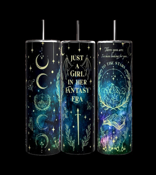 The "Just a Girl Fantasy 20oz Tumbler" by Kreative Kreationz includes three travel tumblers showcasing celestial and fantasy-themed designs adorned with moons, stars, constellations, and the phrase: "Just a girl in her fantasy." One tumbler features a sword graphic while another displays a mountain scene with an open book, all equipped with spill-proof lids for your adventures.