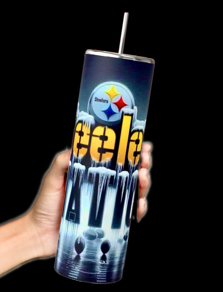 A hand holds a tall Steelers Nation - 20oz Skinny Tumbler by Kreative Kreationz, featuring a futuristic design with vivid colors on a black background. It has an insulated body and spill-proof lid, complemented by a metal straw, perfect for team spirit.