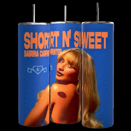 Three retro-style cylindrical tumblers with straws, branded as "Short & Sweet Sabrina Carpenter 20 oz Tumbler" by Kreative Kreationz, showcase a blonde woman and the text “Short N’ Sweet” and “Sabrina Carpenter” in bold orange letters against a blue background. Each durable tumbler has a 20 oz capacity and keeps beverages hot or cold.