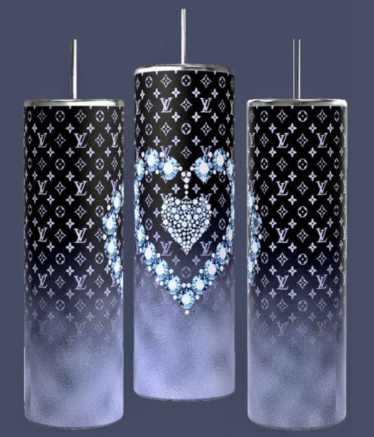 Three LV Designer 20oz Tumblers by Kreative Kreationz feature a tall, cylindrical design with spill-proof metallic lids and straws. They showcase a black and white designer pattern, with the middle tumbler adorned with a heart design crafted from blue flowers. Each tumbler transitions to a gradient foggy gray towards the bottom.