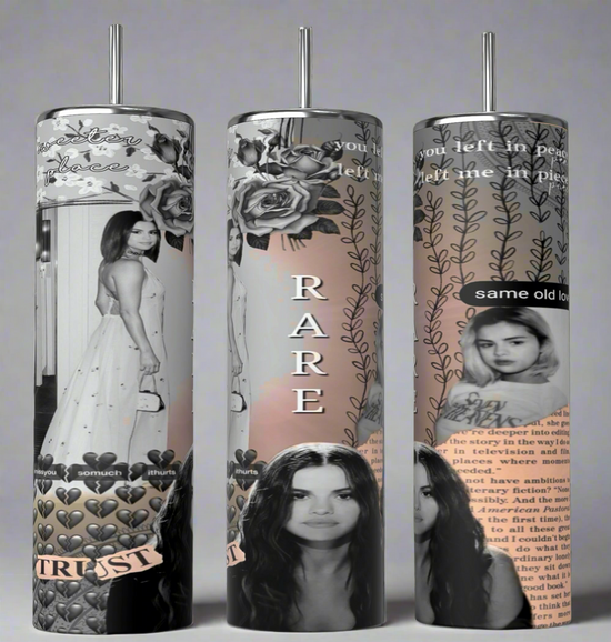 Three tall tumblers are decorated with images of Selena Gomez in different poses; one in a white dress, one with a serious expression, and one in casual attire. The designs, reminiscent of intricate Stanley cups, are embellished with flowers, leaves, hearts, and text like 