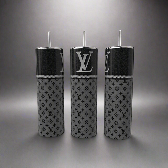 Displayed on a gray background, the LV 20oz Skinny Tumblers by Kreative Kreationz feature silver lids and straws. Each tumbler has a black and gray monogram 