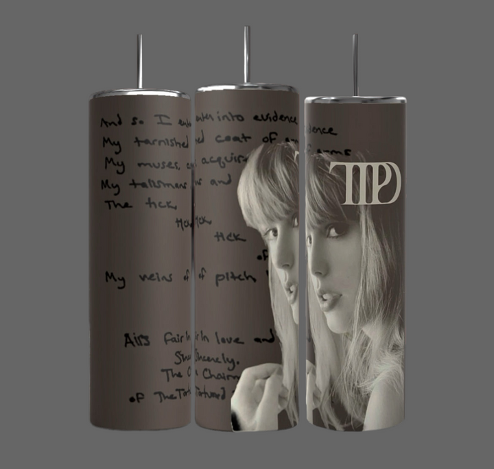 A set of three TTPD The Manuscript 20oz Tumblers by Kreative Kreationz featuring a grayscale image of a woman with long hair and bangs. One tumbler proudly displays a stylized "TAYLOR's Version" logo. The durable construction keeps beverages hot or cold, while handwritten text provides an artistic background.