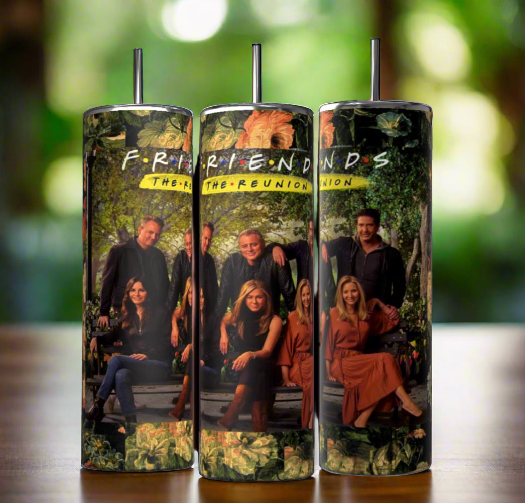 Three cylindrical tumblers are displayed against a black background. Each Kreative Kreationz The Reunion Friends TV Show 20oz Tumbler features an image of a group of people sitting and standing in front of a lush, green background with the text "F.R.I.E.N.D.S The Reunion" at the top, complete with double-wall insulation and a reusable straw.