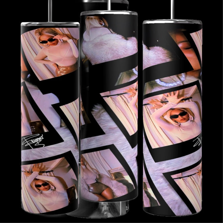 A set of three tall, glossy tumblers featuring a collage of Beyonce in various poses. The design includes handwritten text, camera graphic, and a white hat. These personalized cups have metal straws inserted on top and a black background.