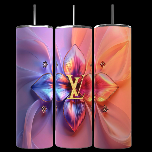 Three tall, cylindrical LV Puffy 20oz Tumblers by Kreative Kreationz come complete with metal straws. The first tumbler showcases a gradient background transitioning from blue to violet, adorned with a large, colorful floral centerpiece. The middle and right tumblers feature similar floral designs, each boasting unique color gradients and durable construction for maximum longevity.