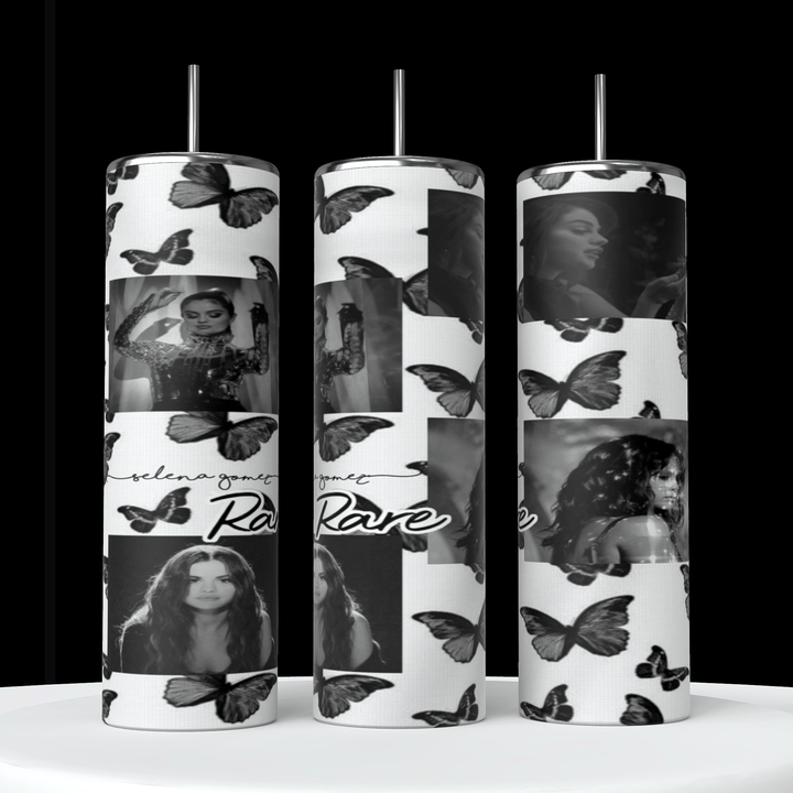 Three Selena Gomez Butterflies 20oz Stainless Steel Tumblers by Kreative Kreationz are shown with black and white designs featuring Selena Gomez in various poses, along with butterflies and the text “Rare.” The background is predominantly white, adorned with images of the same woman intermixed with butterfly illustrations.