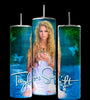 The Debut Taylor Swift 20oz Tumblers by Kreative Kreationz come in a set of three, each with reusable metal straws and spill-proof lids. They feature an image of a woman with curly blonde hair holding a green object, set against a background of green swirls and butterflies. The name 