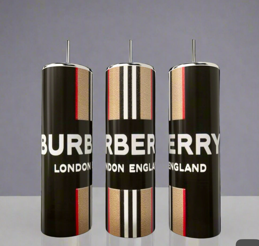 Three sleek Burberry 20oz Skinny Tumblers by Kreative Kreationz showcase timeless style with bold black, beige, white, and red stripes. Each comes with a metallic straw and displays "BURBERRY LONDON ENGLAND," set against a plain gray backdrop.