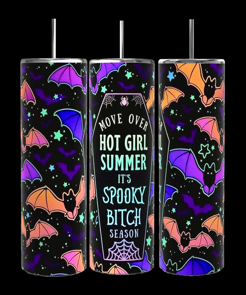 The Spooky Bitch Season Series by Kreative Kreationz is a set of three colorful 20oz tumblers featuring vibrant designs of various jack-o'-lanterns in orange, blue, and purple against a black background. The central Halloween drinkware tumbler has a coffin-shaped design with the text "Move over hot girl summer, it’s spooky bitch season.