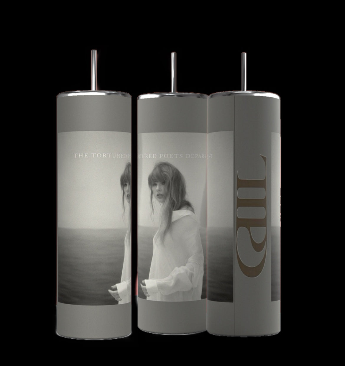 Against a black background, three TTPD grey 20oz Tumblers by Kreative Kreationz are displayed, each topped with a metallic lid. The tumblers showcase a monochromatic image of a woman in a sheer white dress standing by water, accompanied by the text "The Tortured Poets Depart" wrapping around them. These durable tumblers are designed to keep beverages hot or cold.