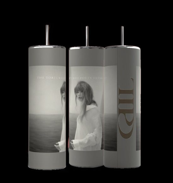 Against a black background, three TTPD grey 20oz Tumblers by Kreative Kreationz are displayed, each topped with a metallic lid. The tumblers showcase a monochromatic image of a woman in a sheer white dress standing by water, accompanied by the text 