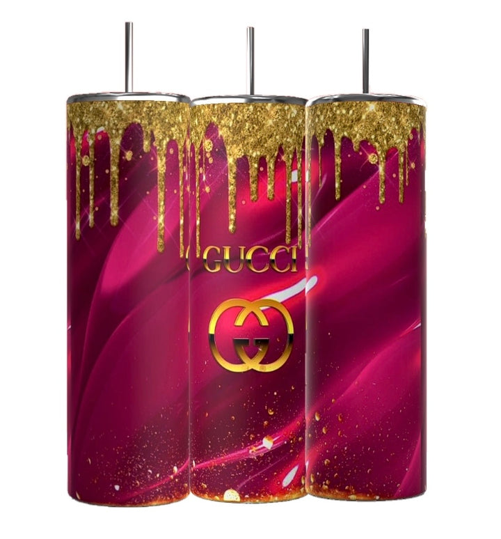 This set includes three 20oz tumblers from Kreative Kreationz, featuring a bold pink and gold design with gold drips on top. The "Gucci" label adds elegance, while their tall and durable build seamlessly combines style and strength. Known as GUCCI Pink Drip tumblers, they also feature straws for convenience.